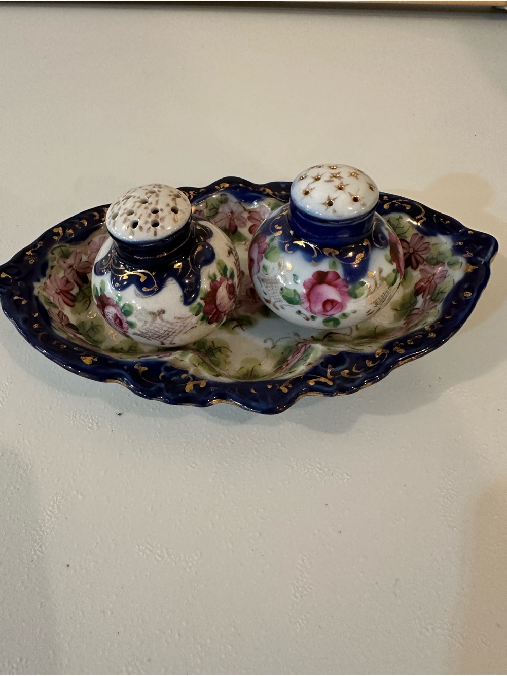 Vintage Floral Porcelain salt and pepper shakers with tray.